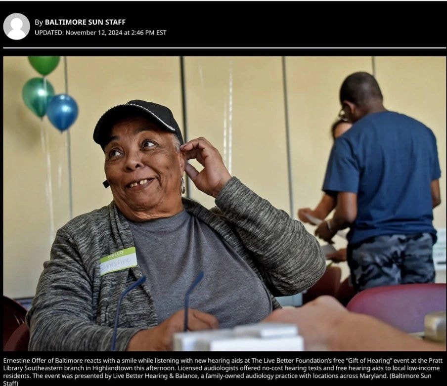 Ernestine Offer of Baltimore smiling while listening with new hearing aids at The Live Better Foundation's free Gift of Hearing event